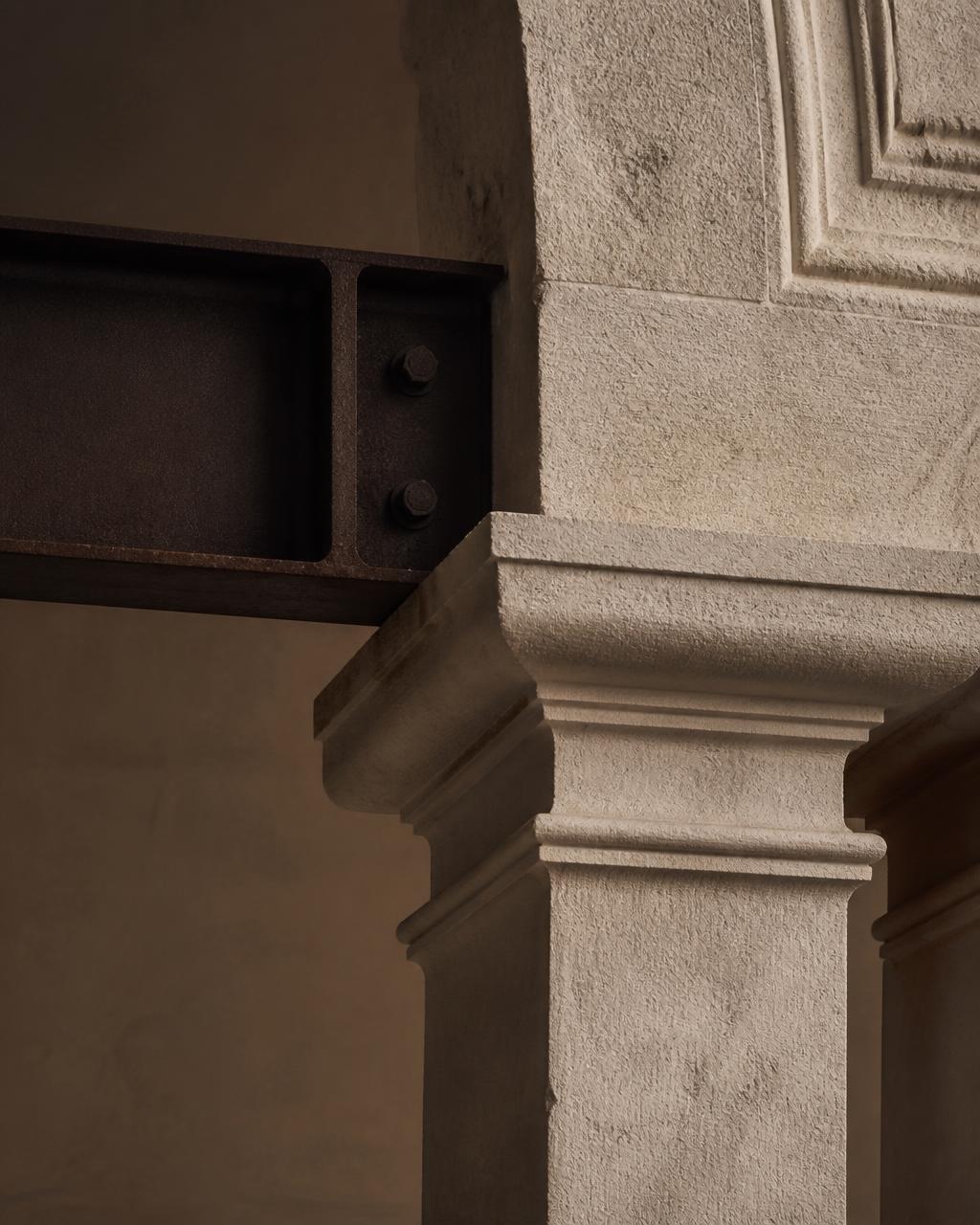 Carved stone and steel joinery architectural detail